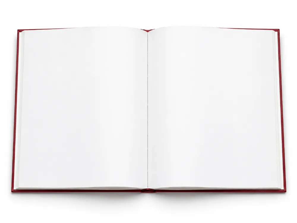 A linen hardcover photo book lying open and flat, showing two blank pages, with a red cloth edge at the sides.